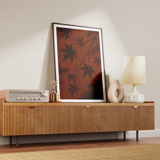Wooden sideboard with decorative items against a beige wall