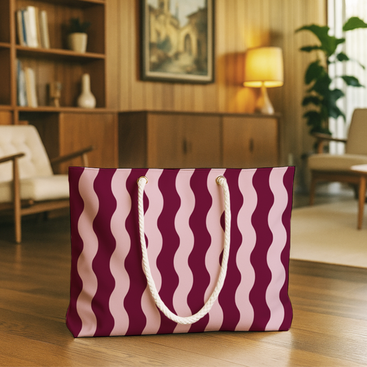 Purple and pink wavy patterned bag on a wooden floor with a living room in the background